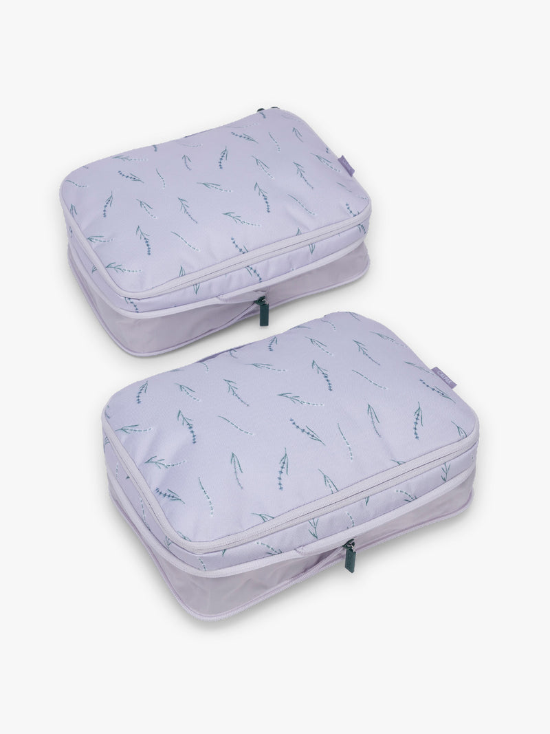 CALPAK Medium Compression Packing Cubes (Set of 2) uncompressed in light purple with lavender print in Lavender Bloom