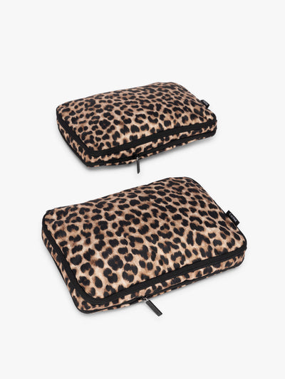 Two tan and black animal print Leopard CALPAK Medium Compression Packing Cubes with zippers shown on a clean white background; PCC2201-LEOPARD view 1