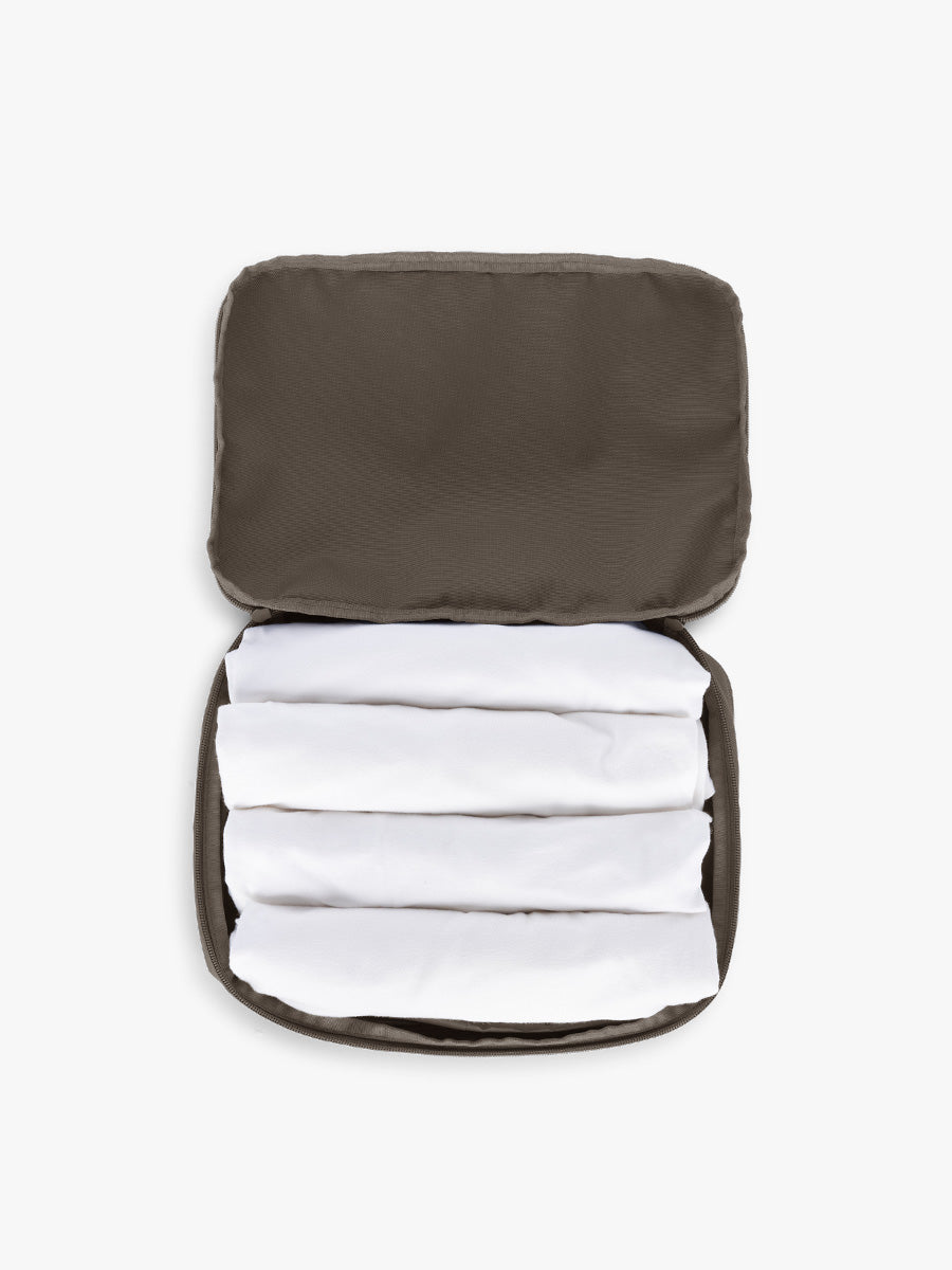 Opened CALPAK Medium Compression Packing Cubes in brown Mushroom; PCC2201-MUSHROOM