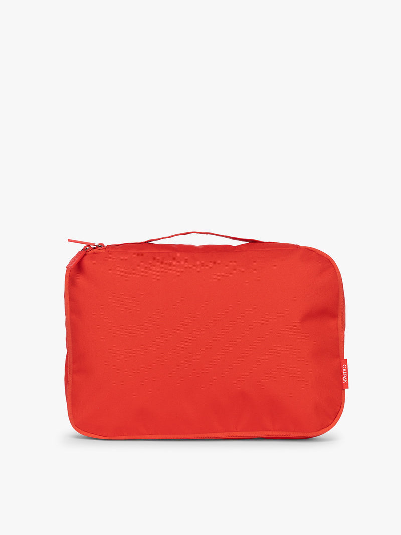 One of CALPAK Medium Compression Packing Cubes in red Tomato