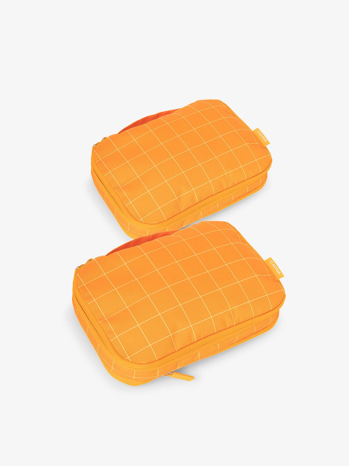 CALPAK small compression packing cubes in orange grid