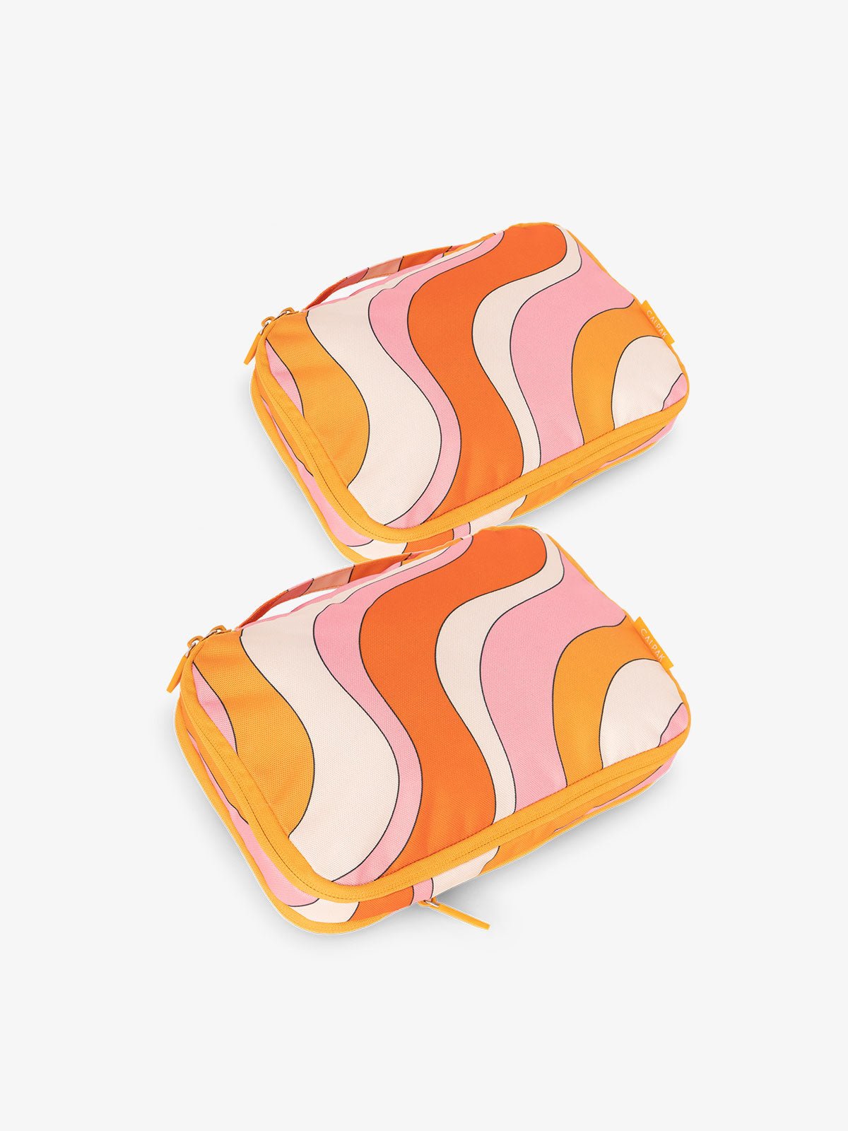 CALPAK small compression packing cubes in orange and pink wavy print