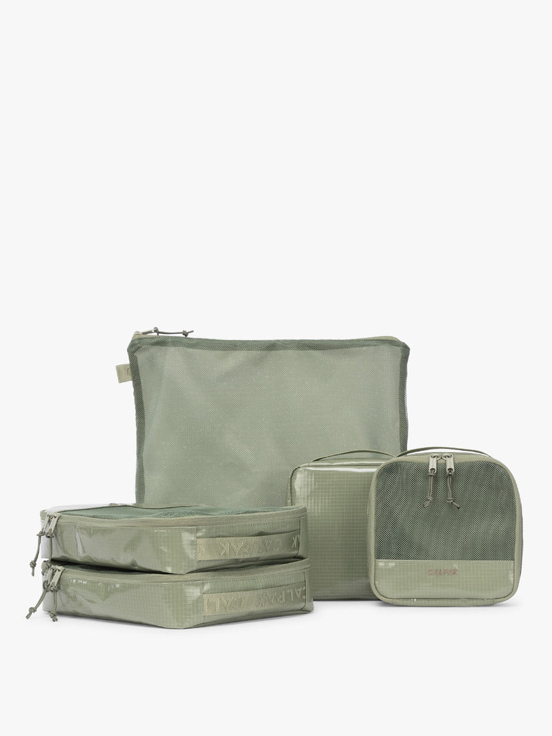 CALPAK Terra 5-Piece Packing Cube Set in olive green Juniper with two small cubes, two medium cubes, and one large mesh cube with zippers and mesh