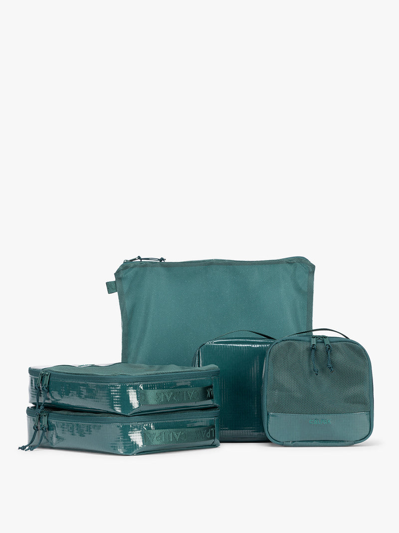 CALPAK Terra 5pc Packing Cube Set in blue green Kale on a white background