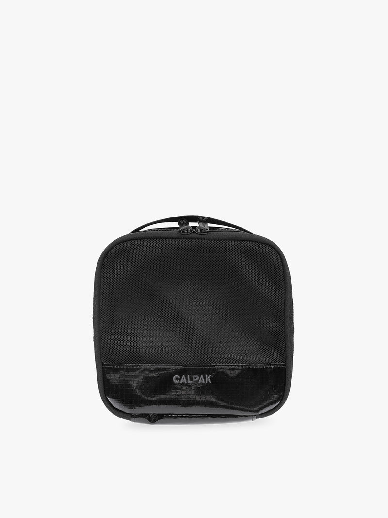 Small size packing cube of the CALPAK Terra 5-Piece Packing Cube Set in black Obsidian with two small cubes, two medium cubes, and one large mesh cube with zippers and mesh