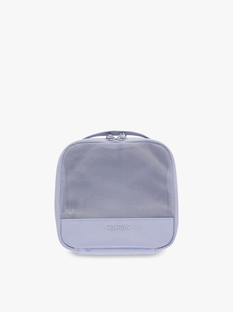 Small size packing cube of the CALPAK Terra 5-Piece Packing Cube Set in purple lavender Sea Glass with two small cubes, two medium cubes, and one large mesh cube with zippers and mesh