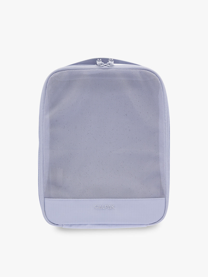 Medium size packing cube of the CALPAK Terra 5-Piece Packing Cube Set in purple lavender Sea Glass with two small cubes, two medium cubes, and one large mesh cube with zippers and mesh