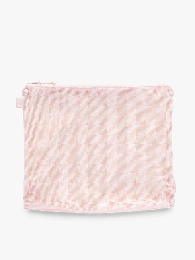 Large size packing cube of CALPAK Terra 5-Piece Packing Cube Set in pink Shell Pink with two small cubes, two medium cubes, and one large mesh cube with zippers and mesh