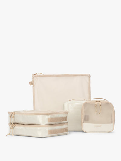 CALPAK Terra 5-Piece Packing Cube Set in off-white beige White Sands with two small cubes, two medium cubes, and one large mesh cube with zippers and mesh; PCT2601-WHITE-SANDS view 1