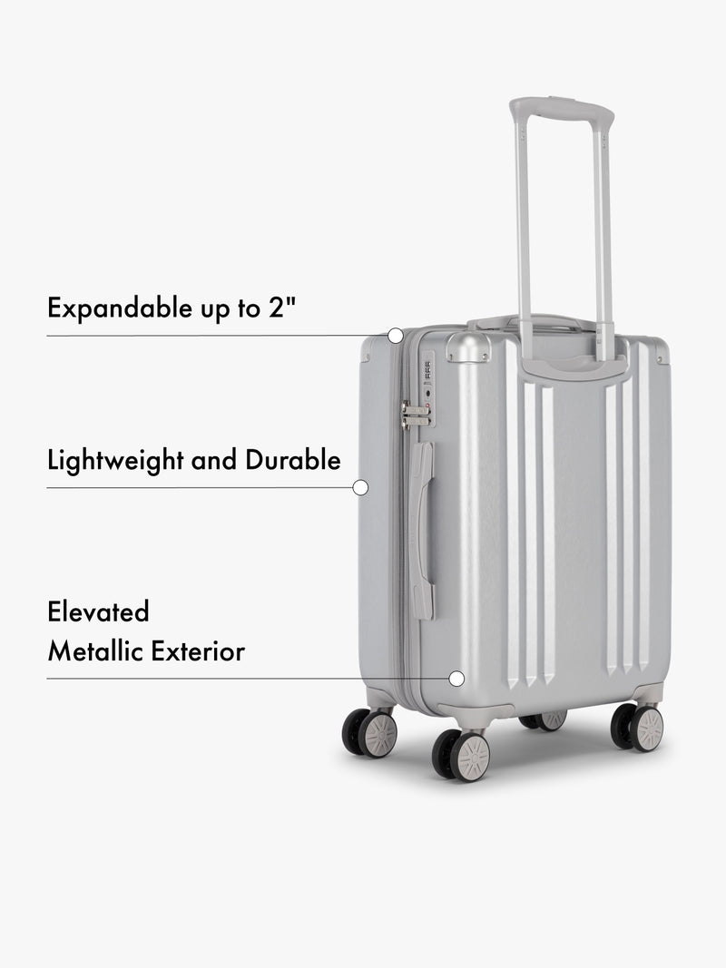 CALPAK Ambeur silver hard shell lightweight rolling spinner carry on suitcase expandable