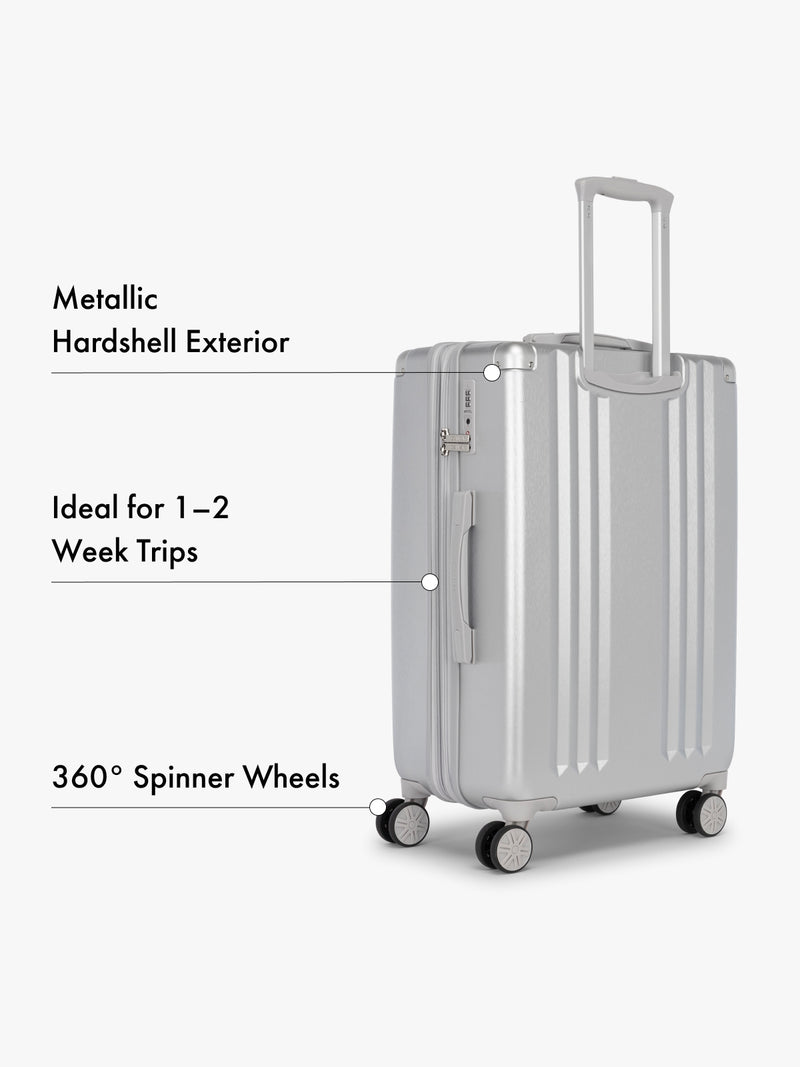 CALPAK Ambeur silver medium 26 inch hardshell suitcase with features highlighted on a white background