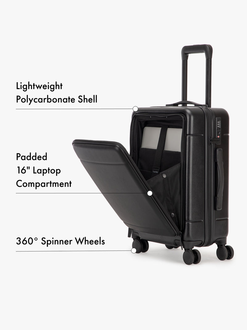 CALPAK Hue hardside carry-on Black suitcase with open laptop compartment on a white background