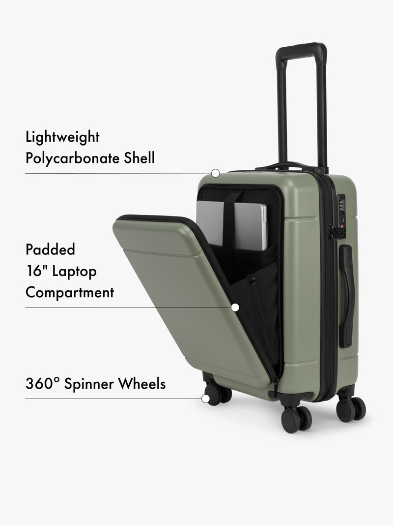 CALPAK Hue Front Pocket Carry On in green with open laptop compartment on a white background
