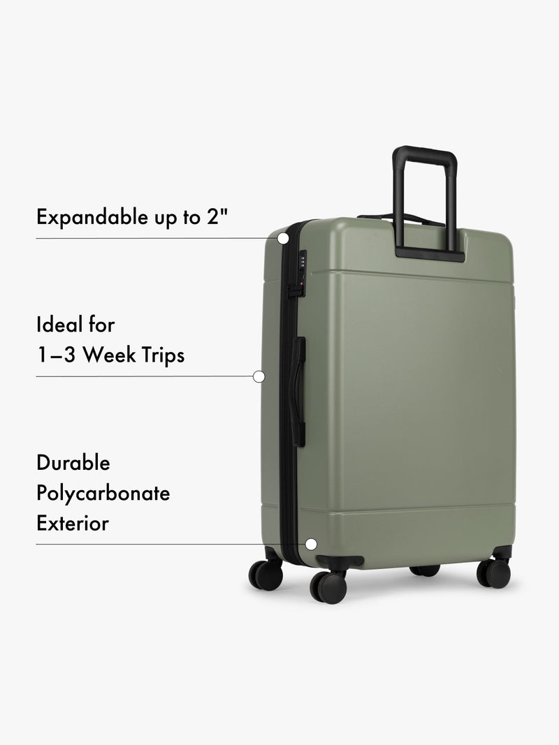 CALPAK large green suitcase with text highlighting features on a white background