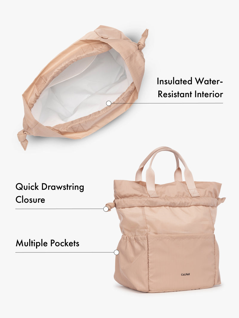 Water resistant interior CALPAK insulated lunch bag with drawstring closure and multiple pockets in pink with features highlighted on white background
