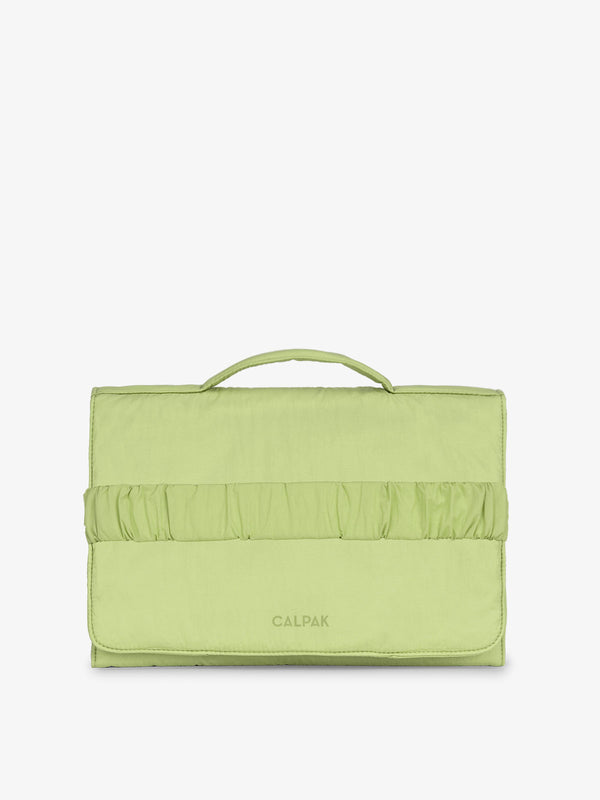 CALPAK Portable Changing Pad Clutch made with Oeko-Tex certified, recycled, and water-resistant material in lime
