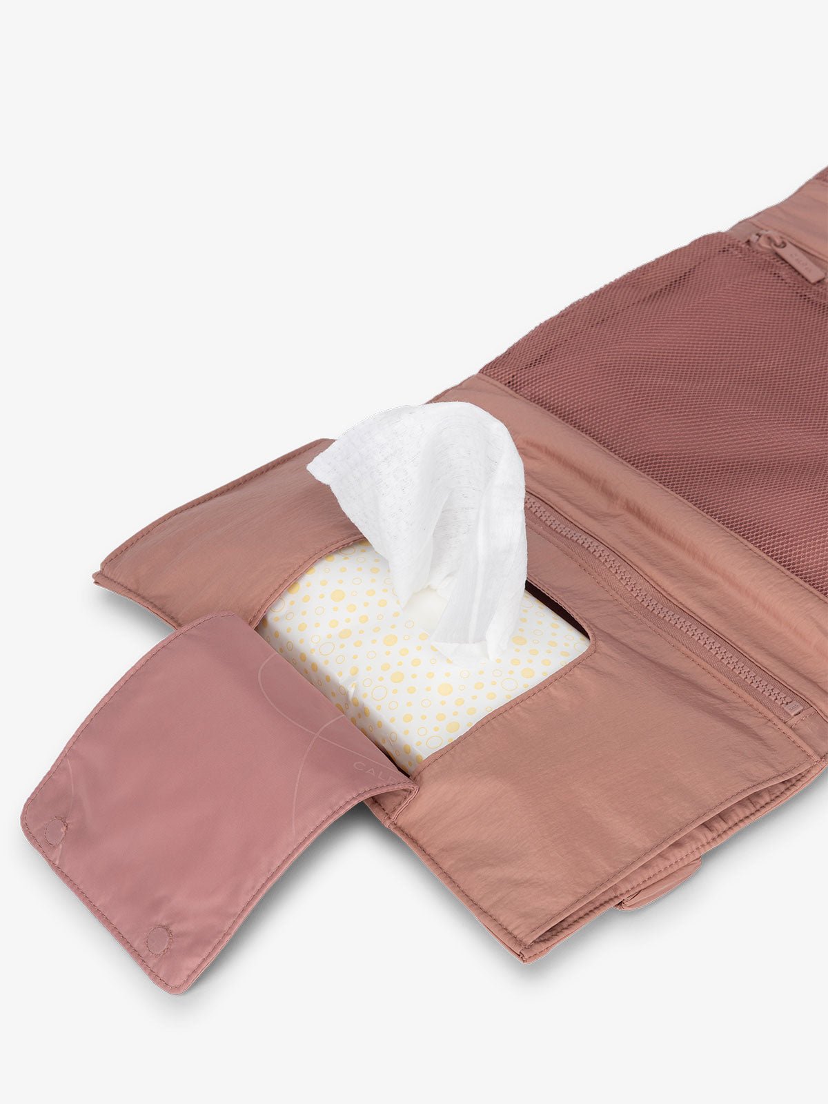CALPAK portable changing pad clutch with dedicated baby wipe pocket in peony pink