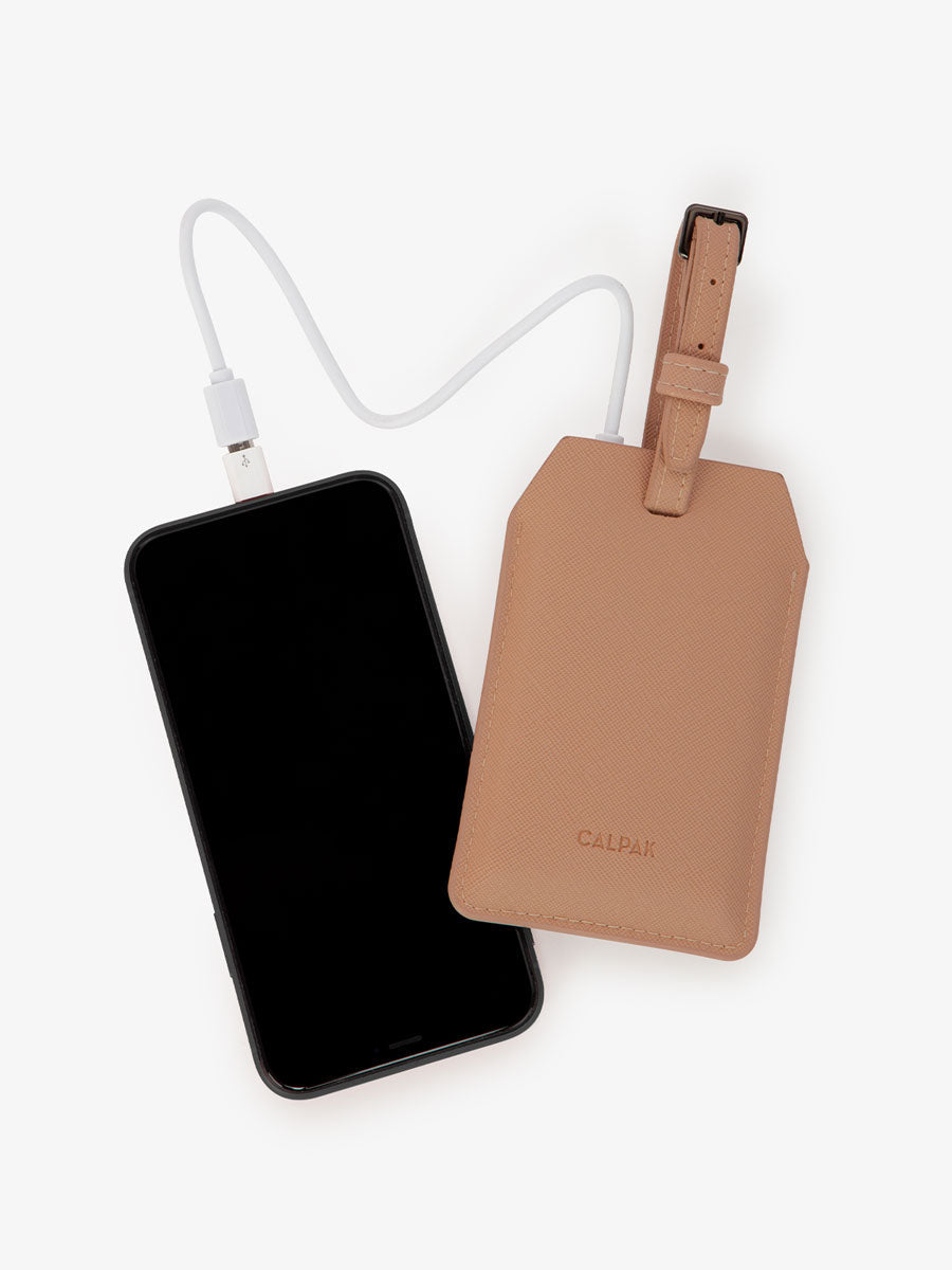 CALPAK Portable Luggage Tag + Charger with USB-C and Lightning adaptor compatibility in caramel; APT2401-CARAMEL