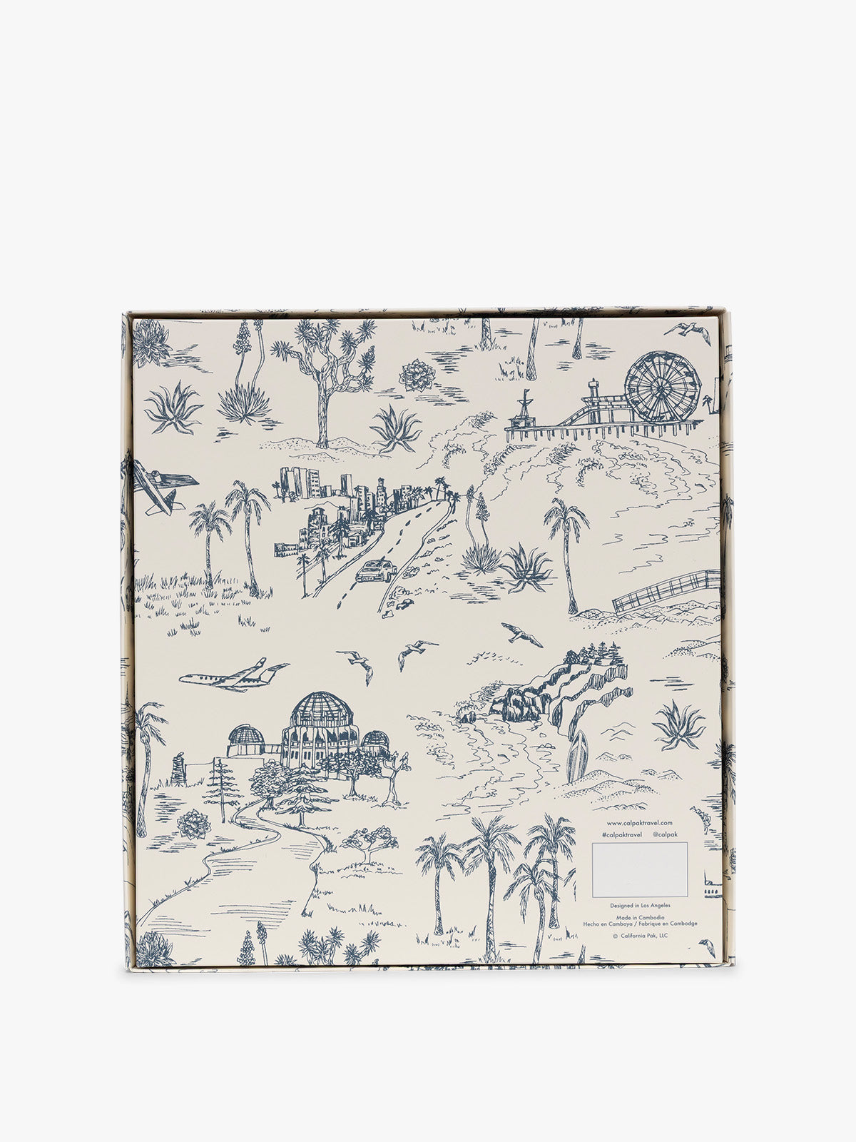 The back side of the gift box, featuring a detailed blue and white toile de Jouy pattern with illustrations of palm trees, domes, a ferris wheel, and small buildings on an off-white background; PWTS2601-DARK-CHERRY