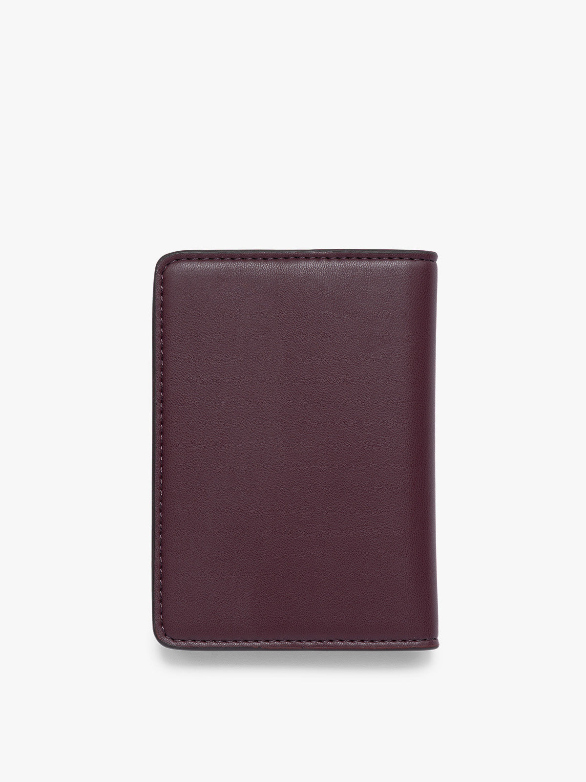 The back side view of dark burgundy CALPAK Passport Holder with visible stitching, shown flat against a clean white background; PWTS2601-DARK-CHERRY