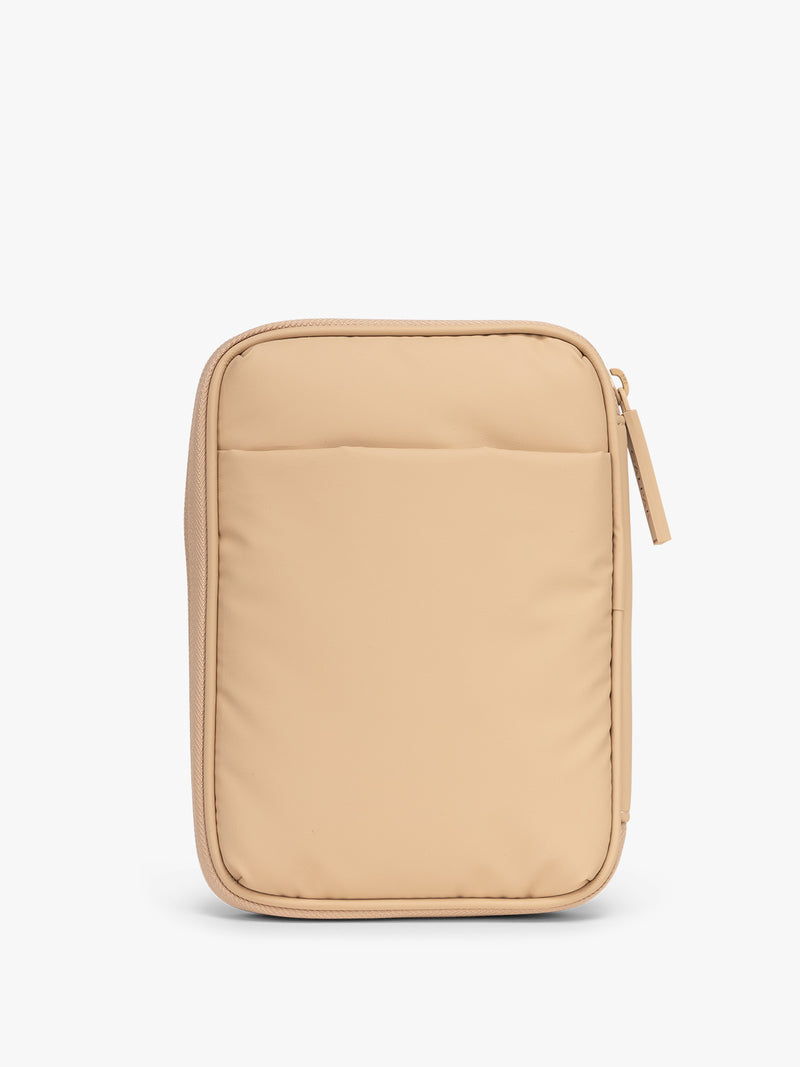Back side with pocket of CALPAK Luka Zip Passport Wallet in beige Latte on a white background