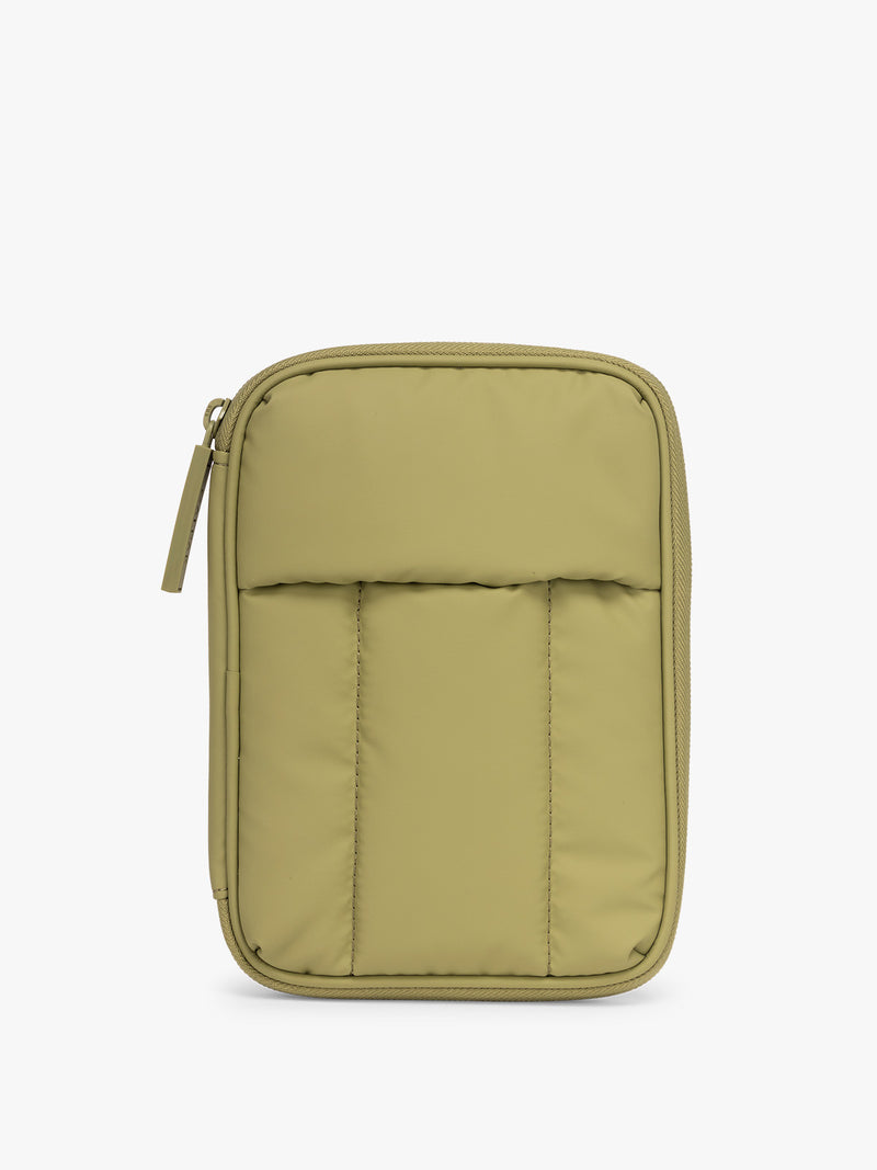 CALPAK Luka Zip Passport Wallet in dark green Pistachio on a white background