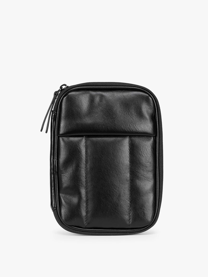 Black CALPAK Luka Zip Passport Wallet in vegan leather with a zippered top and a front pocket, shown on a plain white background