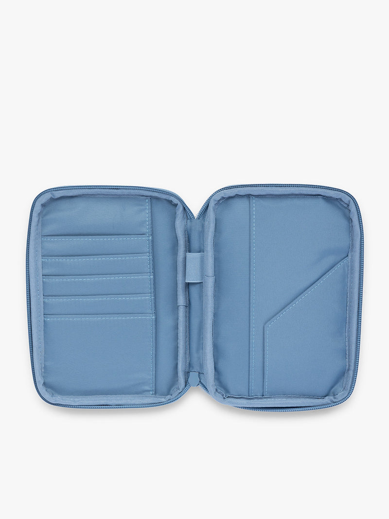 Opened view of the CALPAK Luka Zippered Passport Wallet in white and blue gingham print in French Blue Gingham