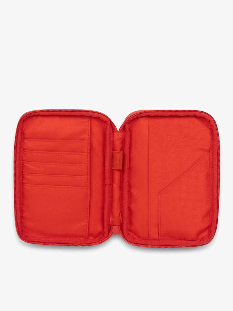 Opened CALPAK Luka Zip Passport Wallet in red Tomato