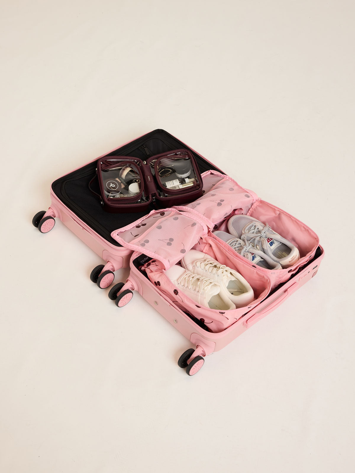 CALPAK Shoe Cubes pink with cherry print in suitcase; KSB2001-BLOSSOM-CHERRY