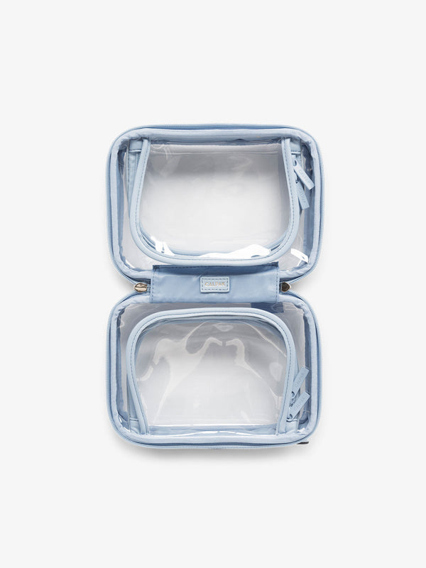 CALPAK small clear skincare bag with multiple zippered compartments in blue