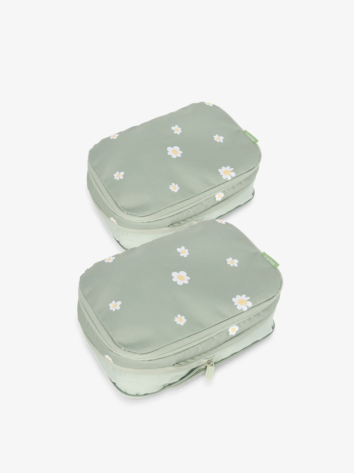 CALPAK small compression packing cubes with top handles and expandable by 4.5 inches in light green daisy; PCS2301-DAISY