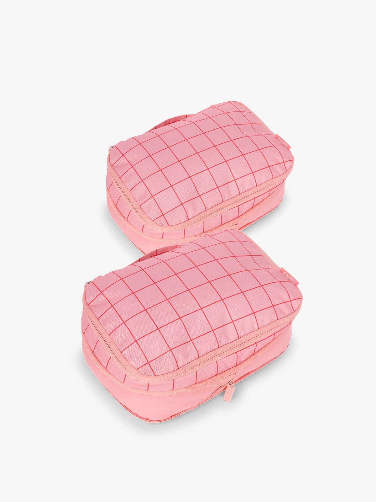 CALPAK small compression packing cubes with top handles and expandable by 4.5 inches in pink and red grid print