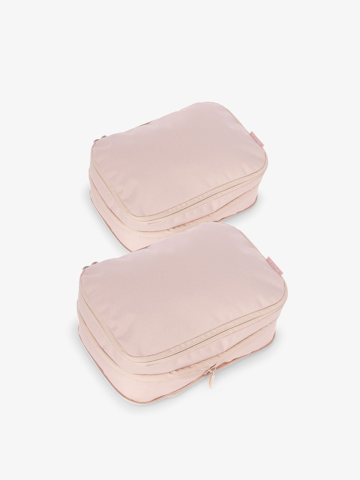 CALPAK small compression packing cubes with top handles and expandable by 4.5 inches in pink; PCS2301-PINK-SAND