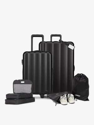 CALPAK starter bundle with carry-on, large luggage, packing cubes, pouches, and luggage tag; LCO8000-BLACK