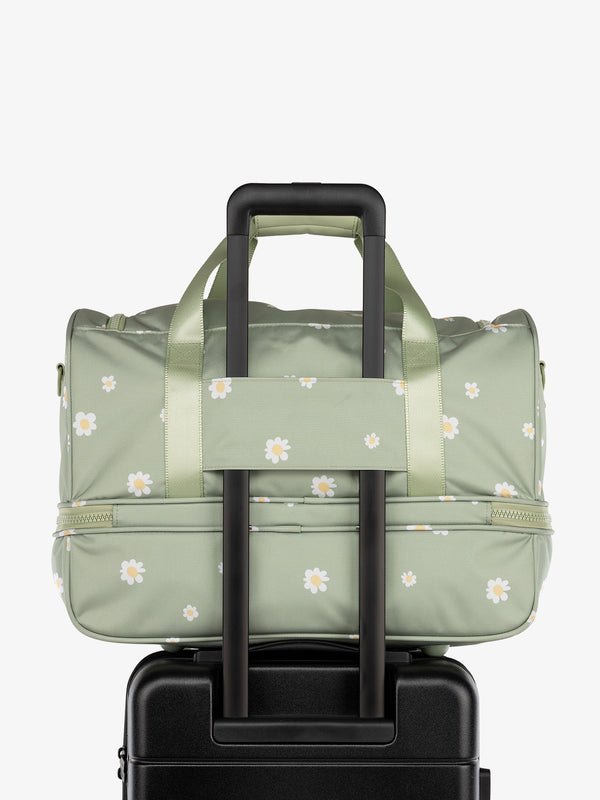 CALPAK Stevyn Duffel bag with trolley sleeve in green floral print