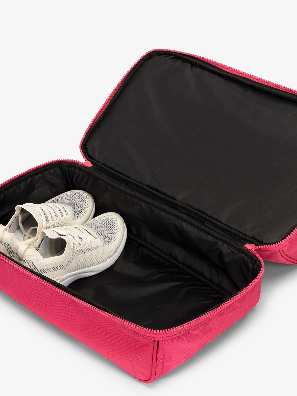 CALPAK Stevyn Duffel bag with bottom shoe compartment for travel in pink dragonfruit