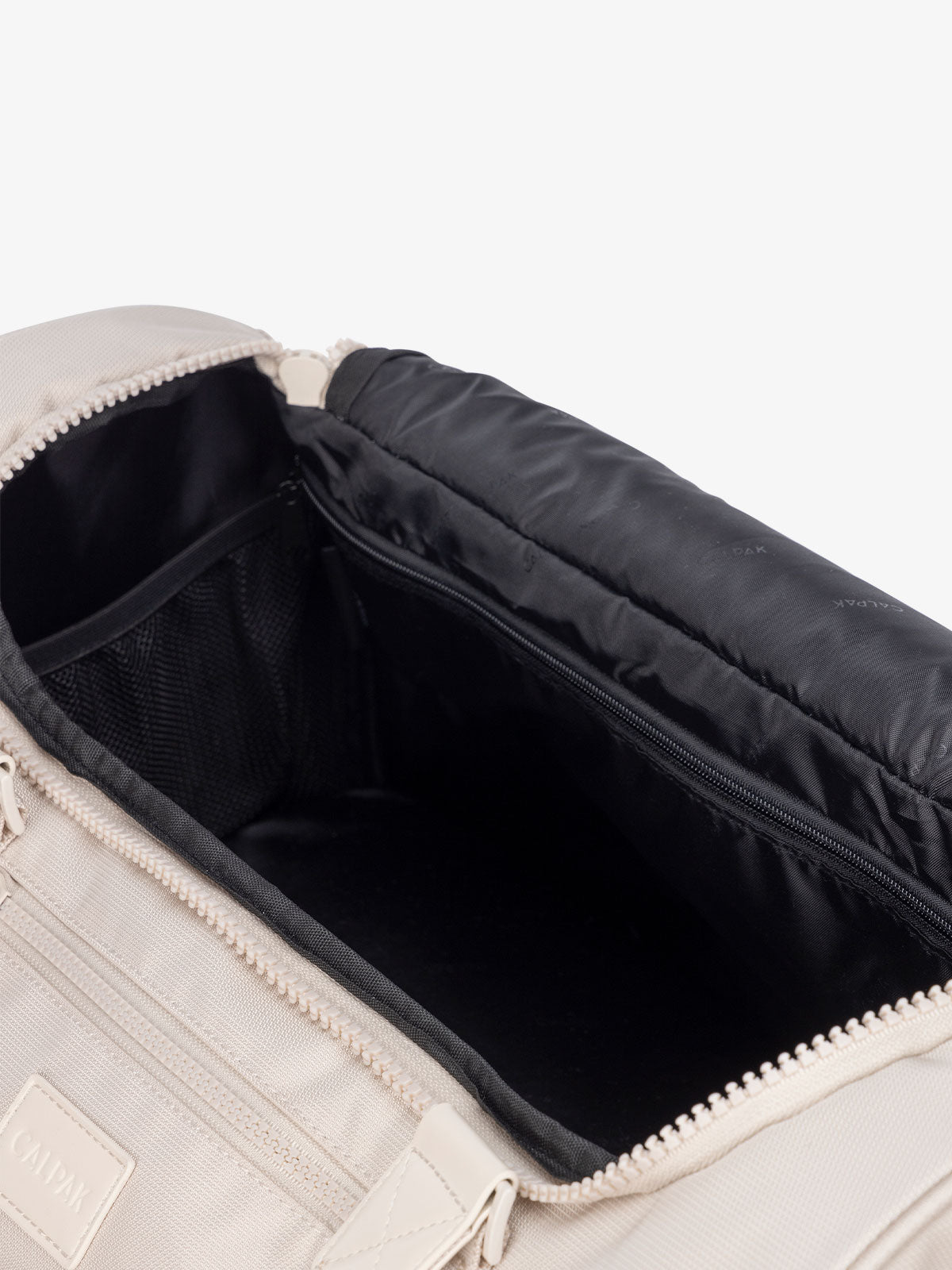 interior of cream dune CALPAK Stevyn duffel bag; DST7019-DUNE