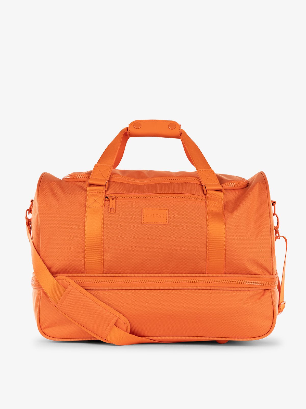 CALPAK Stevyn Duffel bag with removeable crossbody strap orange
