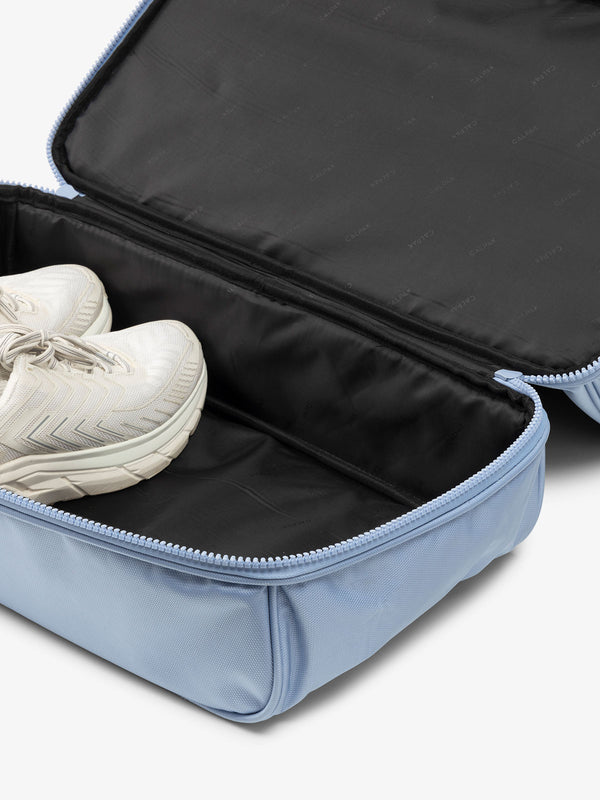 CALPAK blue duffel bag with shoe compartment in light blue