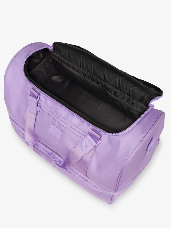 CALPAK Stevyn Duffel with multiple interior pockets in purple