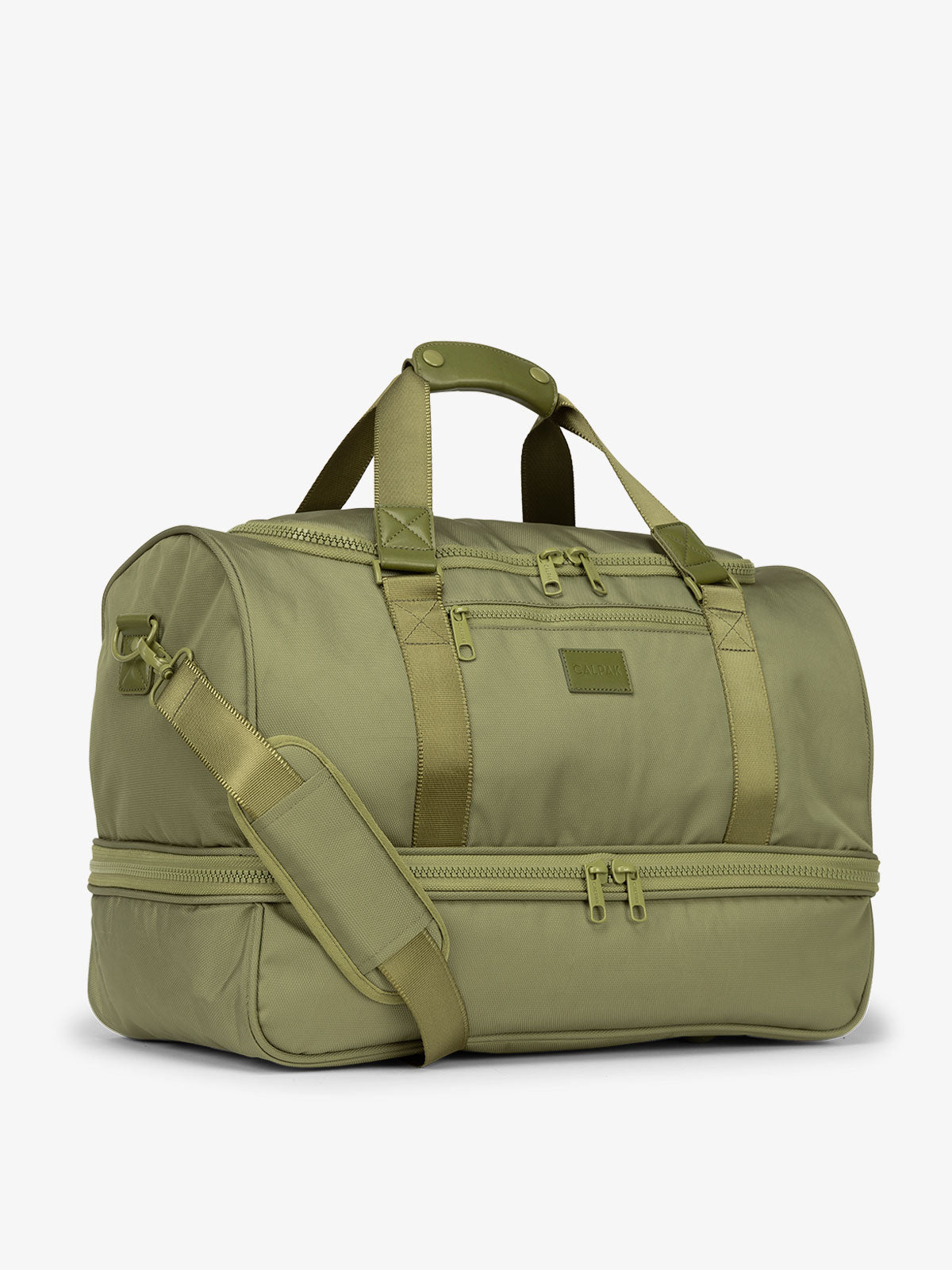 Side-view of green pistachio CALPAK Stevyn Duffel with strap, carry handles, and zippered compartments; DST7019-PISTACHIO