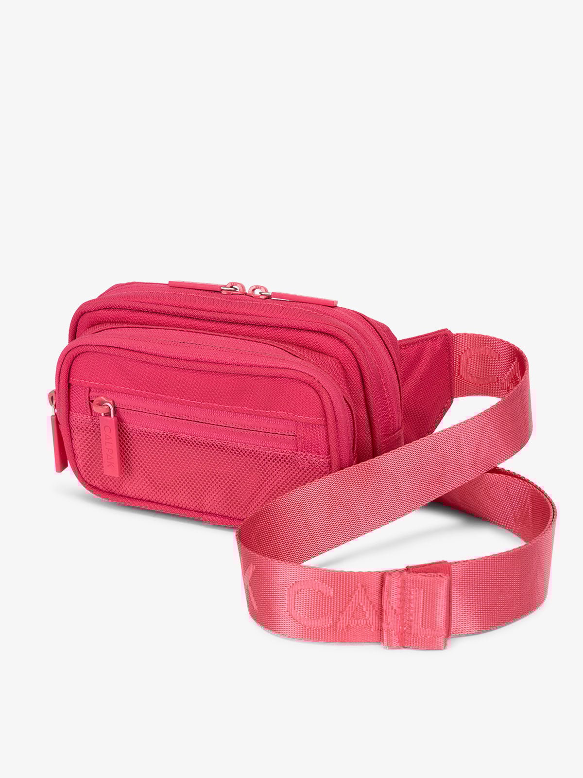 Hot pink CALPAK Stevyn Fanny Pack with adjustable crossbody strap
