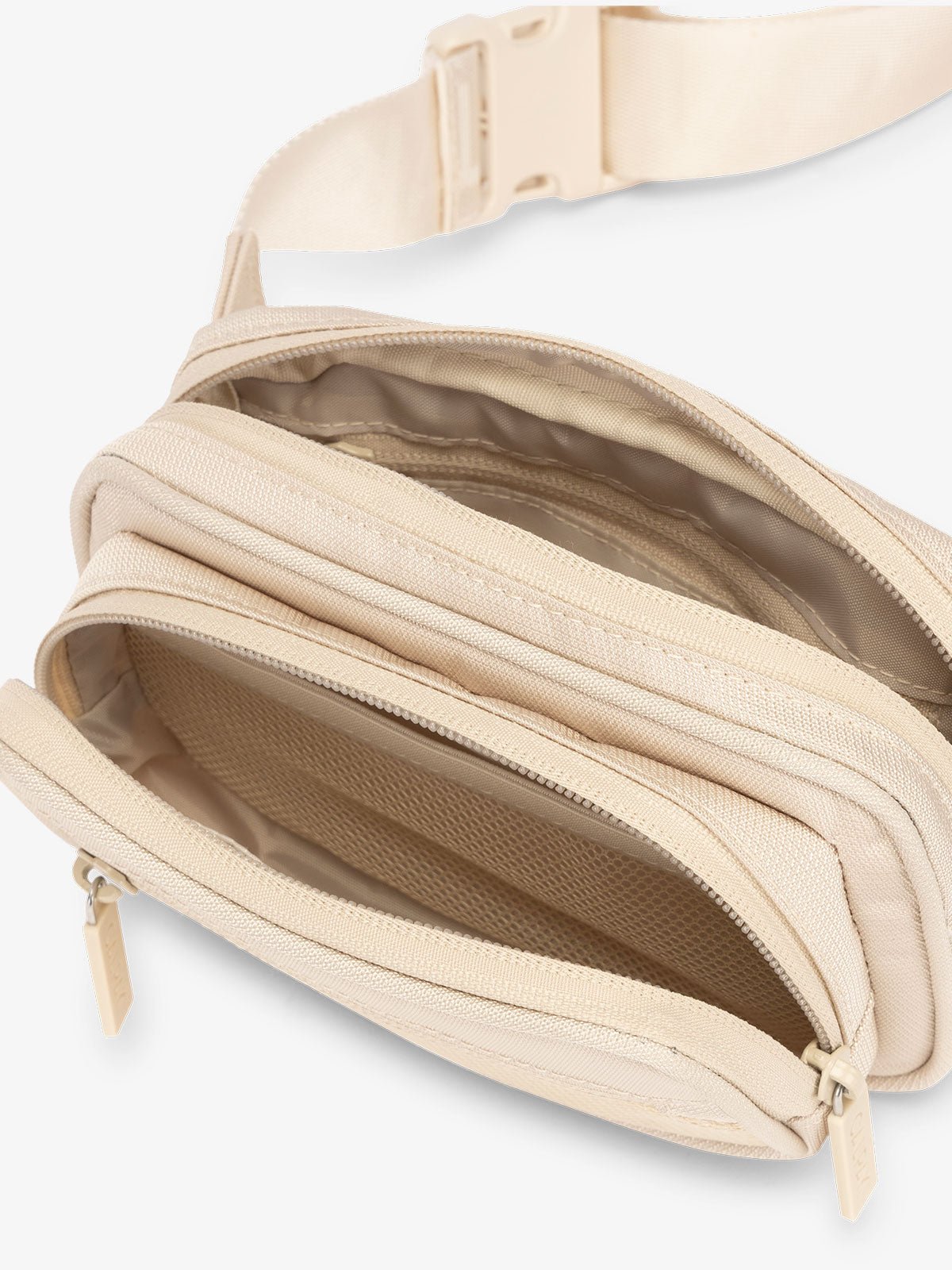 RFID CALPAK fanny pack with front zippered pocket, multiple interior and exterior pockets in cream dune