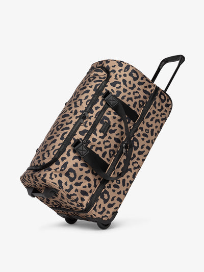 CALPAK large rolling travel duffel bag with wheels in cheetah; DRL2301-CHEETAH