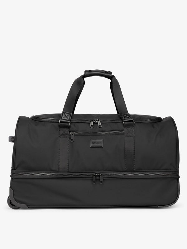Black CALPAK large rolling duffel bag featuring dual handles, zipper enclosed compartments, and shoe compartment