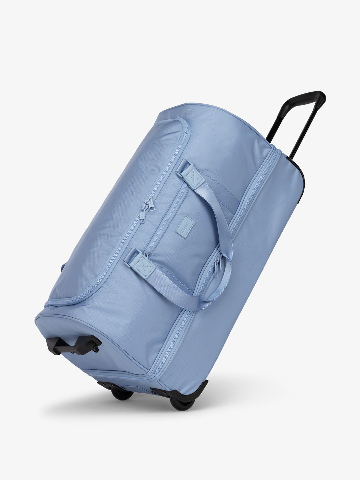Side view of sky blue large rolling travel duffel bag with wheels