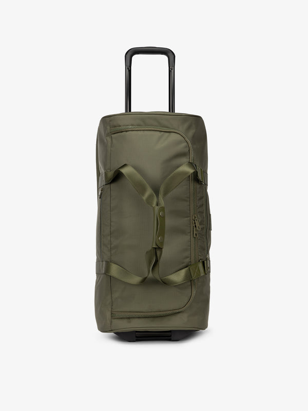 CALPAK large rolling duffel bag with wheels featuring extended top handle in moss