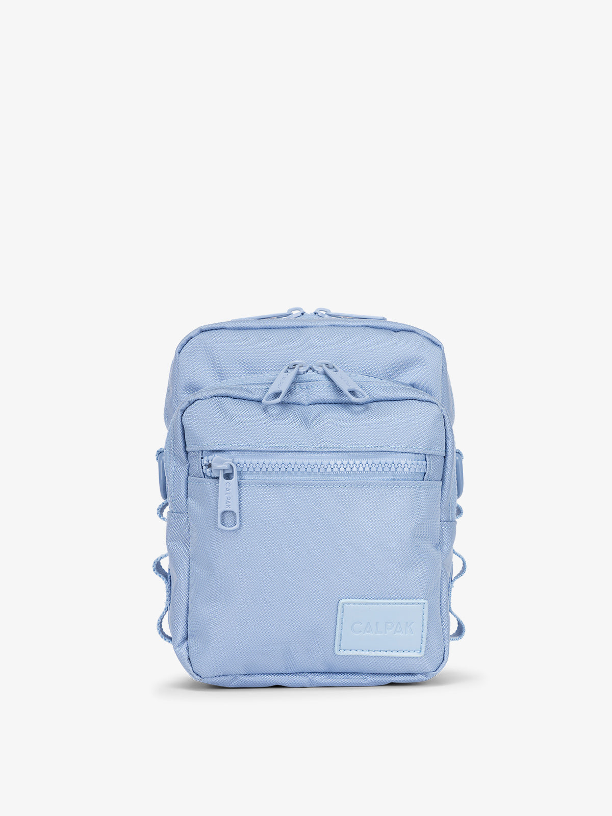 Front-view of CALPAK Stevyn Mini Crossbody Bag with zippered pockets and side panel daisy chains in sky blue
