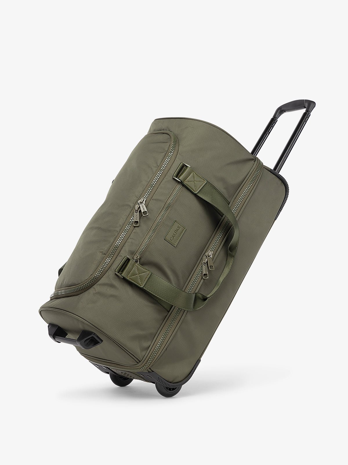 CALPAK Stevyn Rolling Duffel side view with top handle extended in moss